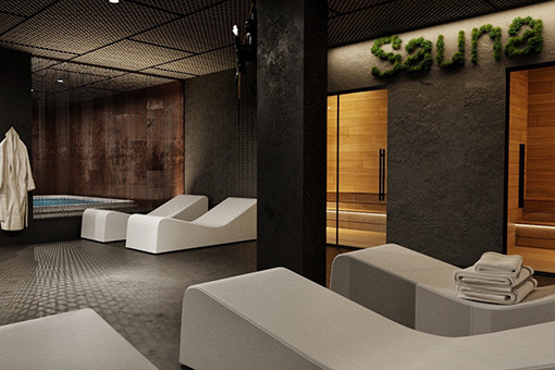 Wellness area with sauna, lounge chairs, and jacuzzi.